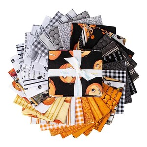 May include: A collection of 18 fabric squares featuring a Halloween theme. The squares are in black, white, orange, and yellow with various patterns and designs. Some squares feature pumpkins, while others have text such as "PRX AND BAN" and "SECRET XC it is wet".