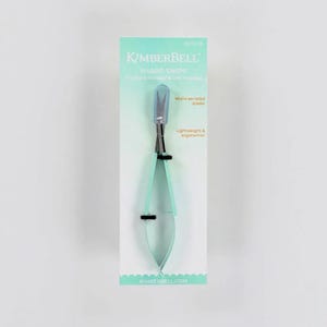 May include: A pair of Kimberbell Sharp Snips on a white and light green card. The snips have a micro-serrated blade and a light blue handle. The card reads "Sharp Snips" and "Lightweight & ergonomic."