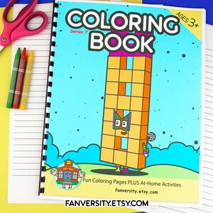 May include: A blue and yellow coloring book with a cartoon building on the cover. The book is titled "Coloring Book" and has the words "Series 7" and "Ages 3+" on the cover. The book is designed for children to color.