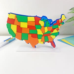 Geographie-Puzzle und Modell der USA - Geographie-Lernwerkzeug - MINT für Kinder
