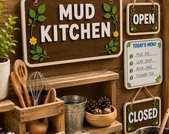 May include: A wooden mud kitchen sign with white text, accompanied by smaller signs labelled OPEN, CLOSED, and TODAY'S MENU with items like MUD PIE and LEAF SOUP. The set includes a wooden crate with kitchen utensils, a metal bucket, and a bowl.