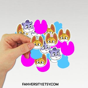 May include: A collection of colorful cartoon character stickers featuring a variety of expressions. The stickers are on a white background and include pink, blue, and purple shapes.