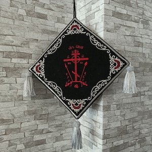 May include: Black velvet diamond-shaped ornament with silver embroidery. The ornament features a red embroidered cross with the text "Св. Георгий" in Cyrillic script.