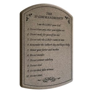 May include: A rectangular, arched-top plaque with the text "THE 10 COMMANDMENTS" and the Ten Commandments. The plaque is a light gray color with black text and decorative flourishes.