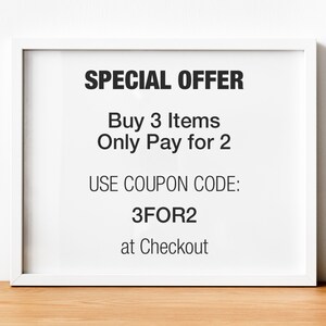 May include: White framed sign with black text that reads "SPECIAL OFFER Buy 3 Items Only Pay for 2 USE COUPON CODE: 3FOR2 at Checkout"