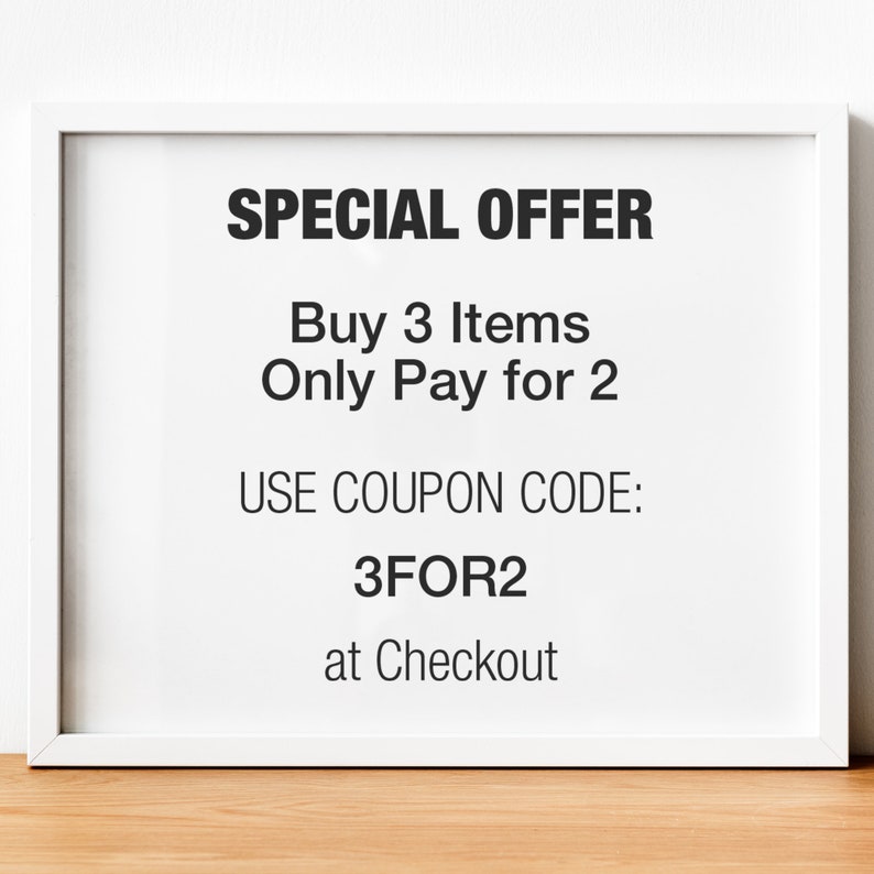 May include: White framed sign with black text that reads "SPECIAL OFFER Buy 3 Items Only Pay for 2 USE COUPON CODE: 3FOR2 at Checkout"