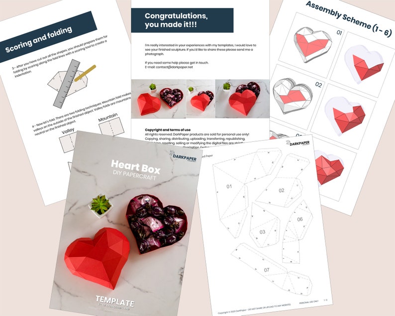 May include: A printable papercraft template for a heart-shaped box. The template includes instructions for scoring and folding the paper to create a 3D box. The image also shows a completed heart box with a red and white color scheme.