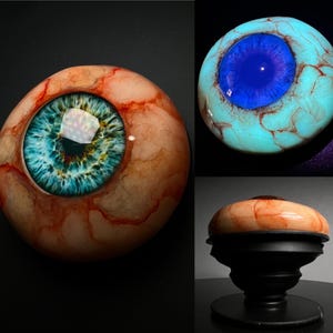 Agarre para teléfono con forma de globo ocular intercambiable Venas realistas Globo ocular que brilla en la oscuridad Regalo de Halloween Espeluznante Escalofriante Aterrador Elección del artista