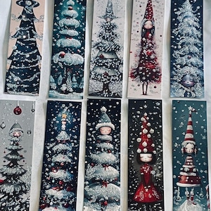 May include: A collection of ten rectangular bookmarks featuring vertical illustrations of stylized Christmas trees and figures in winter attire, decorated with red, white, and dark blue tones, glittery snow effects, and festive holiday ornaments.
