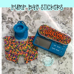 May include: A blue medical feeding pump and a clear plastic bag attachment, both decorated with colorful sprinkle-patterned stickers. The pump features the name JAXSON in orange text on a sprinkle background and the text PUMP BAG STICKERS.