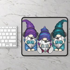 May include: Three gnomes wearing blue and purple hats with headphones and holding video game controllers. The gnomes are on a gray background.