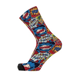 May include: A pair of colorful socks with a comic book design featuring words like "BOOM!" and "BANG!" in red, blue, and yellow.