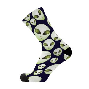 May include: A pair of blue socks with a pattern of green alien faces. The socks are made of a soft, comfortable material and are ideal for everyday wear.
