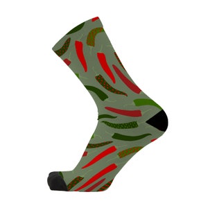 May include: A pair of green and grey socks with a red and green chilli pepper pattern.