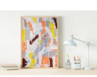 May include: Abstract art print in a wooden frame. The artwork features a colorful composition of orange, yellow, grey, and brown brushstrokes with black lines. A light blue desk lamp, a pen holder, and a small vase with a flower are on the desk.