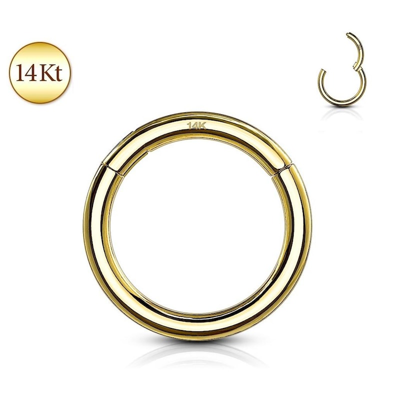 May include: A polished 14Kt gold hinged segment ring with a smooth, circular design. The metal surface is reflective and yellow in color. A small 14K stamp is visible on the top portion of the ring. A smaller version of the ring is shown open.