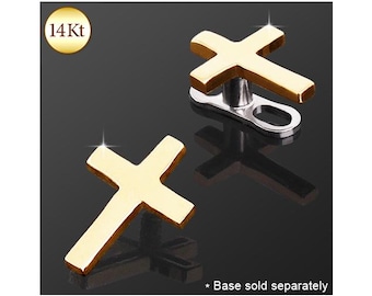 May include: Two 14Kt gold cross-shaped dermal anchor tops. One piece is shown from the front, and the other is shown from an angled perspective revealing the silver-toned metal attachment mechanism. The text 14Kt is visible in a gold circle.