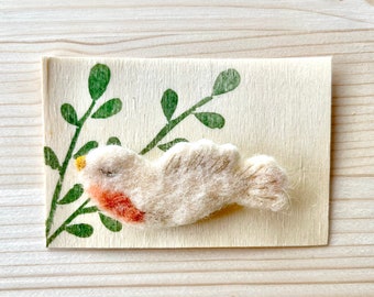 bird brooch in felted wool with embroidery