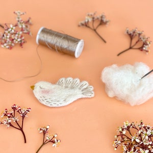 Needle felting and embroidery kit to make a bird brooch