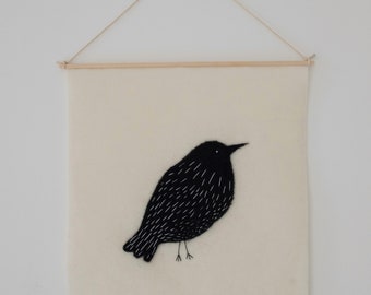 Felted and embroidered banner: the thrush