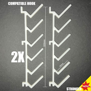 May include: Two white plastic hooks, each with 7 hooks, measuring 22.5 inches tall and 4.5 inches wide. The hooks are labeled "COMPATIBLE HOOK" and "2X".