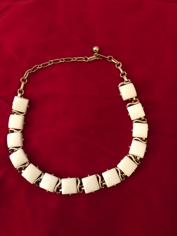 Vintage signed Coro choker with white thermoplastic squares set in goldtone metal.