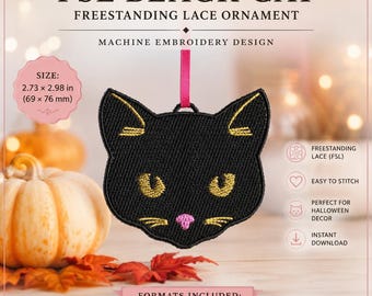 May include: A black cat head machine embroidery design featuring gold stitched eyes, ears, and whiskers with a pink nose. The ornament hangs from a pink ribbon and measures 2.73 x 2.98 inches. Text includes FSL BLACK CAT FREESTANDING LACE ORNAMENT.