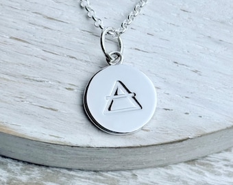 Collar de elementos del zodíaco en plata de ley: dije con símbolo grabado
