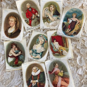 May include: A collection of vintage cigarette cards featuring portraits of historical figures and scenes. The cards are printed on thin paper with a white background and feature colourful illustrations. The cards are numbered and include the names of the artists and subjects.