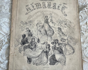 May include: A vintage black and white illustration of a magazine cover for "The Illustrated London News" from 1849. The cover features a group of women and cherubs surrounding a large heart with the year 1849 inside.