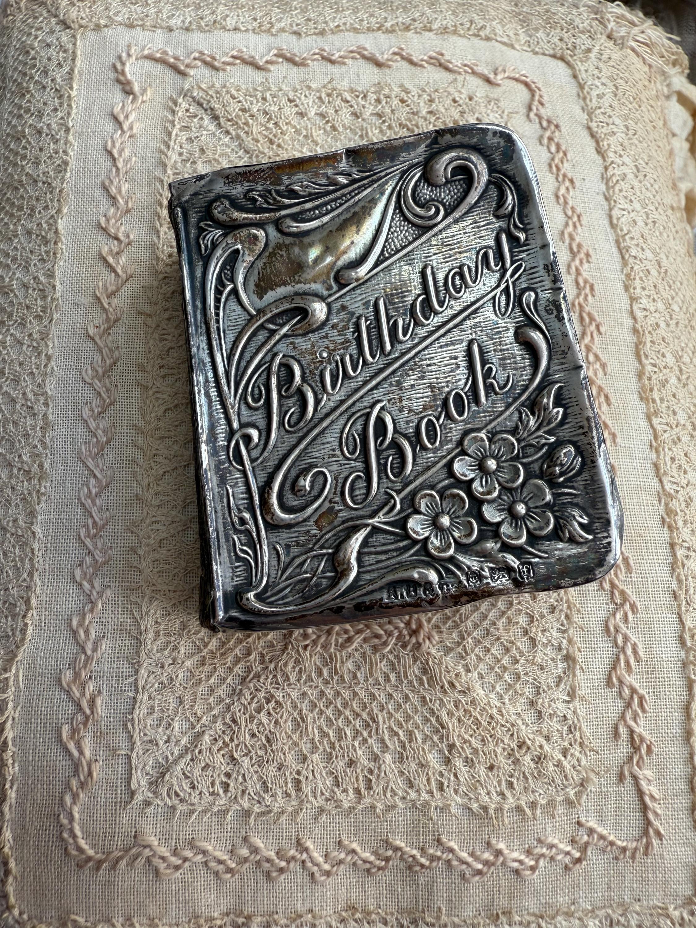 A gorgeous edition of the Royal Bijou Birthday Book with a wonderful art nouveau silver cover.
