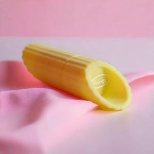 May include: A yellow ribbed silicone toy with the word "Pamper" in a white oval on the side.