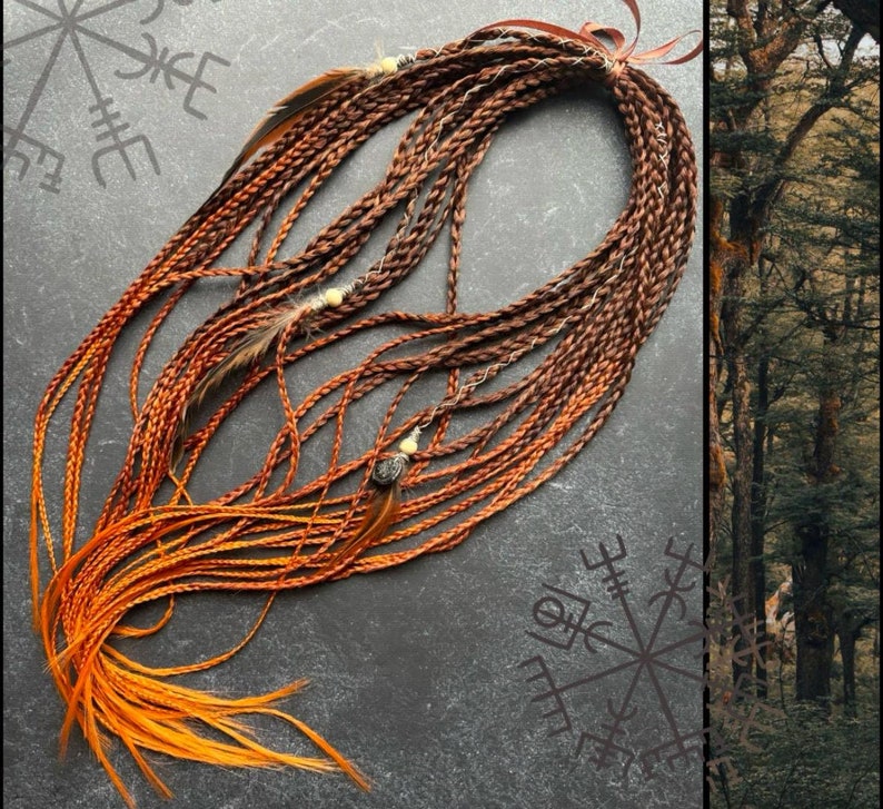 May include: A long, braided hair extension with a gradient of brown and orange colors. The extension is decorated with small beads and feathers.