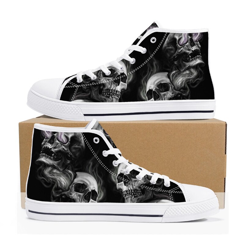 May include: Black and white high-top canvas shoes with a skull and smoke design.