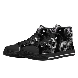 May include: Black high-top canvas sneakers with a skull and smoke design.