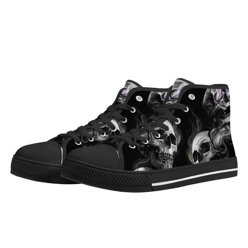 May include: Black high-top canvas sneakers with a skull and smoke design.