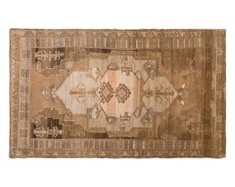 Vintage Handwoven Wool Rug, 60-Year-Old Distressed Geometric Medallion Area Rug