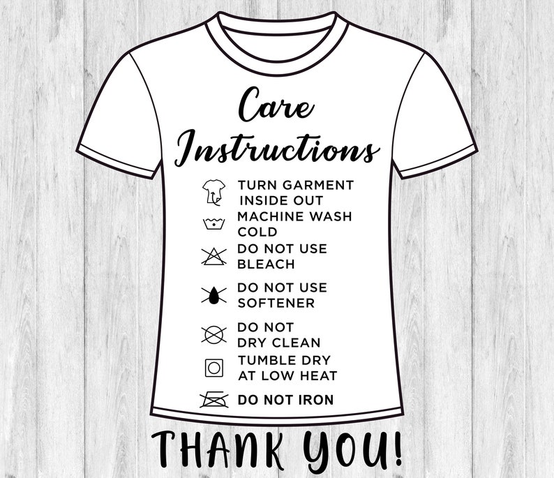 May include: A white t-shirt with black care instructions printed on it. The instructions include turning the garment inside out, machine washing cold, not using bleach or softener, not dry cleaning, tumble drying at low heat, and not ironing. The text "Thank You!" is printed below the instructions.