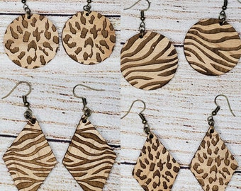 May include: Set of six wooden earrings with a leopard and zebra print. The earrings are available in two shapes: round and diamond.