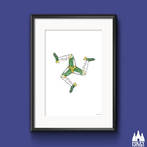 May include: A framed print of the Isle of Man flag, featuring a stylized three-legged symbol in green, white, and yellow on a white background.