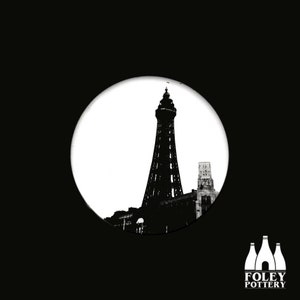 May include: Black and white silhouette of the Blackpool Tower, a famous landmark in Blackpool, England. The tower is depicted in a circular frame against a white background.