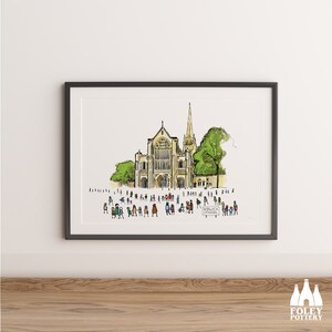 May include: A watercolor illustration of Norwich Cathedral in England, with a crowd of people in front of the building. The text "Norwich Cathedral" is written on a sign in the foreground.