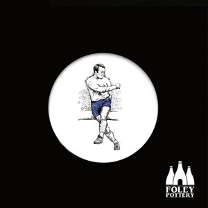 May include: Black and white illustration of a soccer player sitting on a bench with a crowd of spectators in the background. The player is wearing a white jersey and blue shorts. The illustration is on a white ceramic tile with a black border.