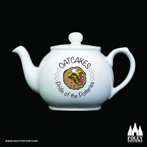 May include: White ceramic teapot with a black and white illustration of an oatcake with toppings. The text "Oatcakes Pride of the Potteries" is printed on the teapot.