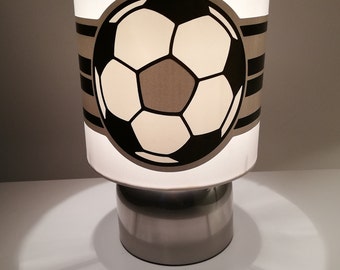 boys touch lamp