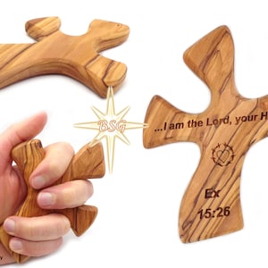 May include: A wooden cross with a heart and wreath design, engraved with the text "...I am the Lord, your Healer" and "Ex 15:26".