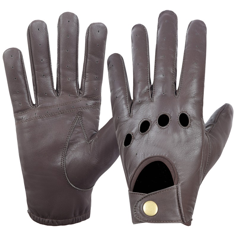May include: A pair of brown leather driving gloves with a perforated design and a button closure on the wrist.