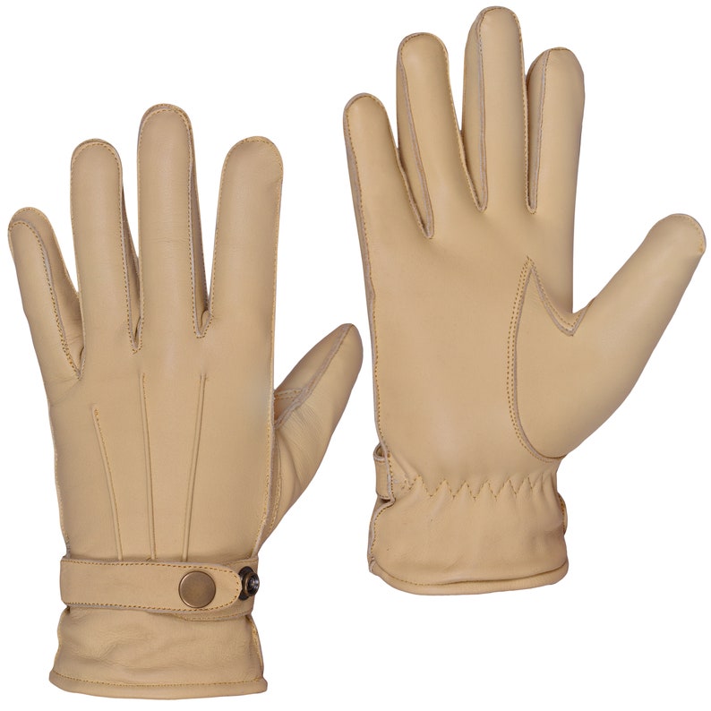 May include: A pair of tan leather gloves with a button closure on the wrist.