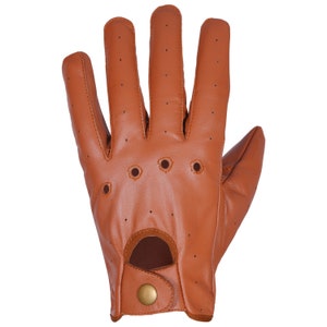 May include: Brown leather driving gloves with a perforated design and a button closure.