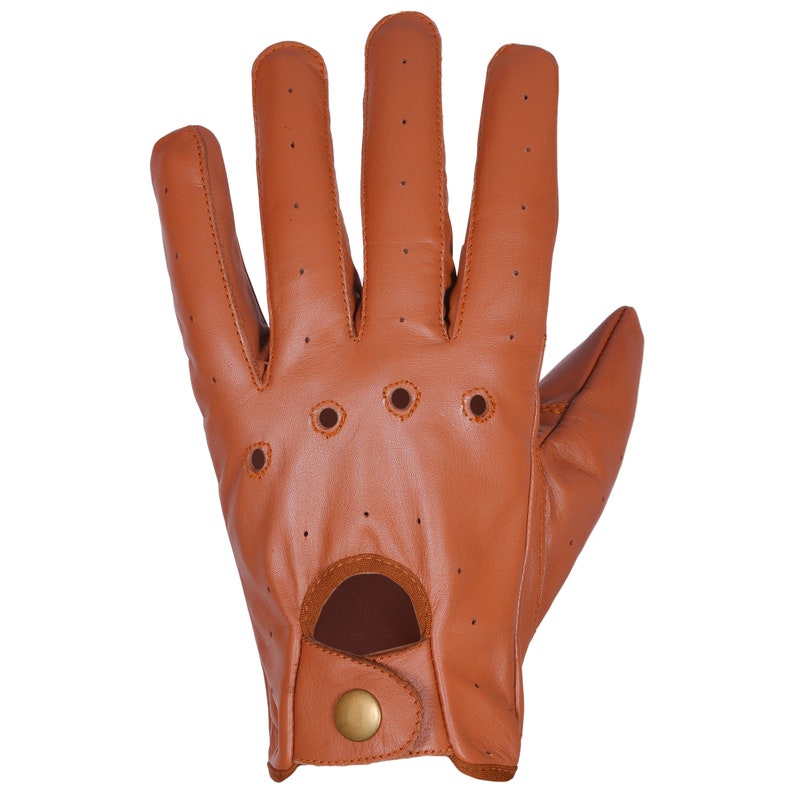 May include: Brown leather driving gloves with a perforated design and a button closure.